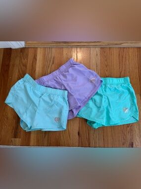 Set of 3 athletic shorts in pristine condition.